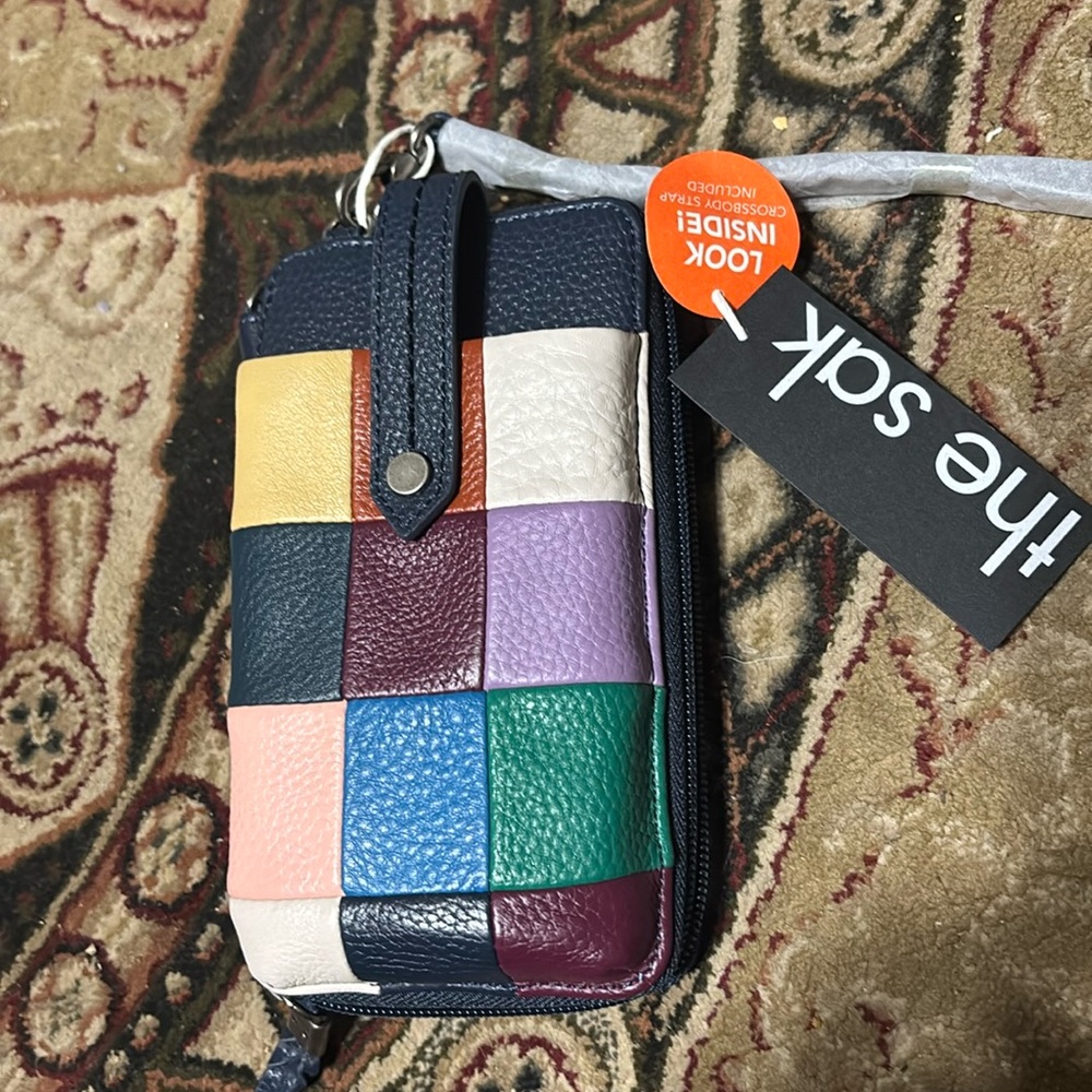 The Sak brand wristlet wallet with crossbody strap
